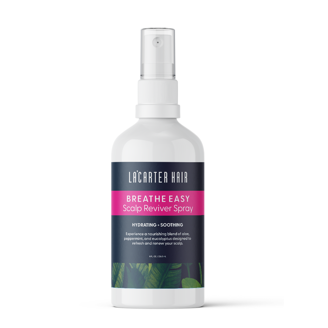 Close-up of Breathe Easy Scalp Reviver Spray bottle with a sleek design, featuring tea tree and peppermint ingredients for scalp hydration and itch relief.